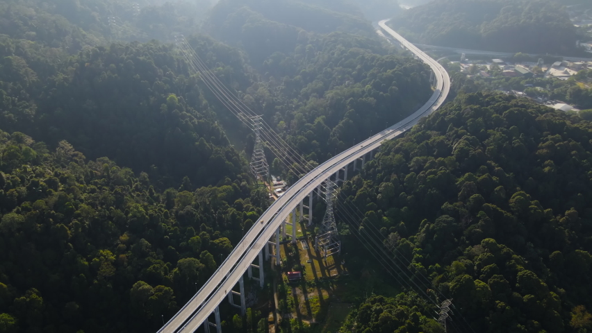 Footage of Rawang Serendah Highway or Rawang Bypass. A nature preserve green sustainable winding road Highway 2.7km length Royalty-Free Stock Footage #1086942941