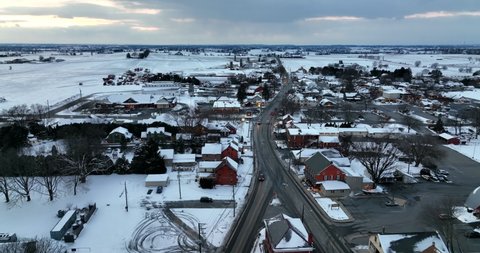 Village of Intercourse PA in Lancaster County Pennsylvania. Winter show scene in evening. Aerial.