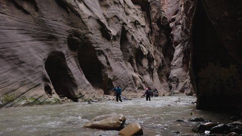 Springdale , Utah , United States - 03 17 2021: Zion National Park, Utah, 18 March 2021 - Groups of People Hiking in the Narrows of Zion National Park
