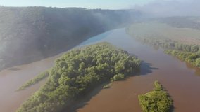 Spectacular bird's eye view of the Dniester river on a foggy morning. Location place Dnister canyon, Ukraine, Europe. Aerial footage, cinematic drone shot. Filmed UHD in 4k video. Beauty of earth.