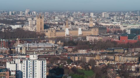 Cinematic Establishing Aerial View Shot of London UK, United Kingdom, Palace of Westminster, British Parliament, delicious day