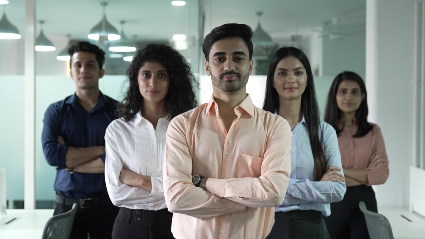 Happy Indian diverse business people office workers team standing in row looking at camera. Multiethnic professional employees executives group posing together for corporate portrait leadership. | Shutterstock HD Video #1086955202