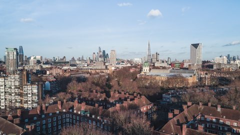 Establishing Aerial View Shot of London UK, United Kingdom, City of London and skyscrapers, slow push in sunny wonderful day