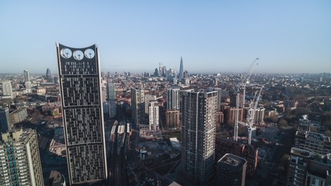 Establishing Aerial View Shot of London UK, United Kingdom, City of London and skyscrapers, push back, revealing Elephant and Castle 