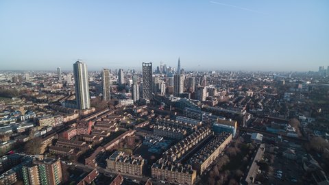 Establishing Aerial View Shot of London UK, United Kingdom, City of London and skyscrapers, push in from far, revealing Elephant and Castle 