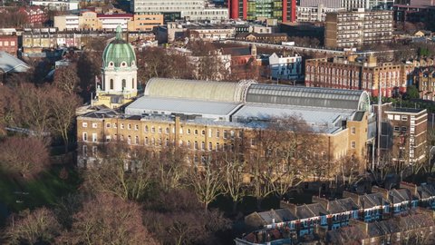 Establishing Aerial View Shot of London UK, United Kingdom, sunny day, golden hour, Imperial War Museum, circling, long lens
