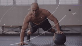 Animation of circles and crosses over fit caucasian man exercising with ball at gym. global sports, healthy and active lifestyle concept digitally generated video.