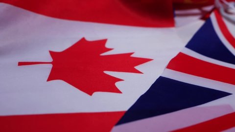 Canadian Nation Flag with Union Jack British flag close up panning shot selective focus