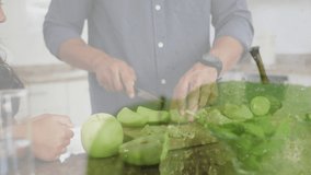 Animation of happy biracial family cooking over apples. family spending time at home concept digitally generated video.