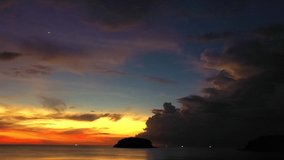 aerial view colorful sky in twilight at Kata beach Phuket.
beautiful dark sky at yellow sunset in Kata beach Phuket Thailand
4k stock footage video in travel concept.