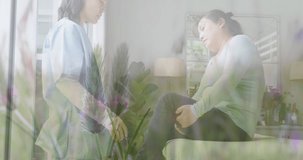 Animation of asian doctor treating female patient over plants. medical and healthcare services concept digitally generated video.