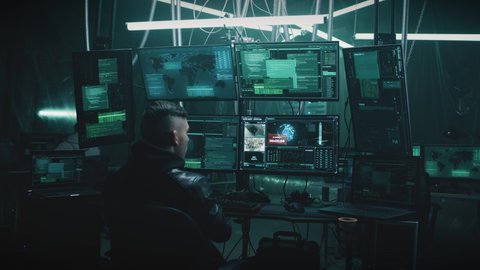 A male hacker in a casual jacket on a chair on secret base, hacking a nuclear weapon launch on a computer with a countdown in a dark cybercriminal hideout