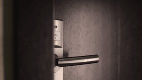 Close up of female hand using keyless entry card for opening door at hotel room. Private pass and security system concept. - Powered by Shutterstock - Get 15% off with code: PIKWIZARD15