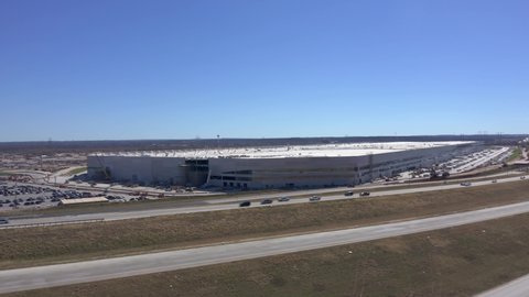 Austin, Texas US. January 29, 2022: Aerial pullback establishing shot of Tesla Gigatexas factory, Tesla headquarters in Austin Texas