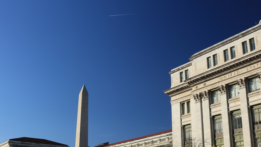 The U.S.D.A. headquarters, U.S. Department of Agriculture Jamie L. Whitten Building in Washington, D.C. The camera pans from the Washington monument to the south facing facade on Independence Avenue