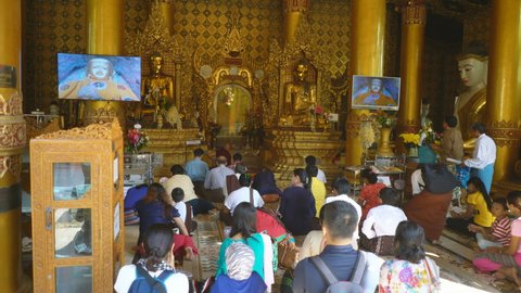 YANGON, MYANMAR - 2TH FEBRUARY, 2019: Tourists and local people in the Shwedagon Pagoda, Yangon, Myanmar, Asia