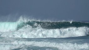 Ocean Waves. Power of waves breaking splashing sea-spray water foam 