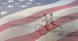 Animation of flag of united states of america over happy senior couple with bikes on beach by sea. american history, patriotism and independence concept digitally generated video.