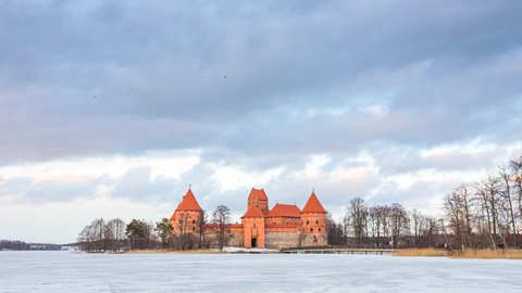 Day to evening timelapse of Trakai medieval castle in Lithuania at winter