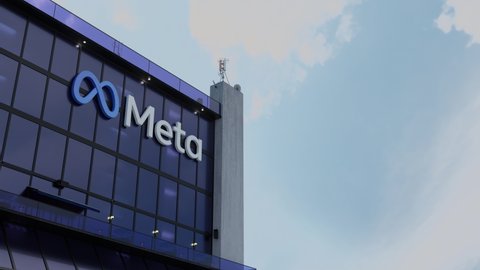 METAVERSE, FEBRUARY 2022 - Meta Platforms Stock Sinks Post Q4 Earnings. Mega-growth potential of the metaverse looms. (3D CGI Hyperlapse Animation of Meta Platforms Logo on Corporate Building)