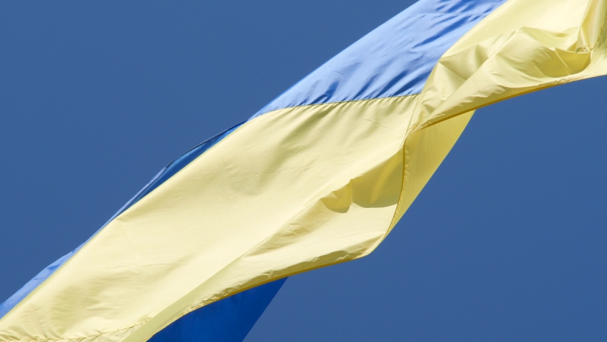 Slow motion of Ukraine flag waving background sky blue and yellow national color Ukrainian yellow-blue. Ukraine flag wind waving national symbol country. Highly detailed fabric texture flag of Ukraine | Shutterstock HD Video #1086991394