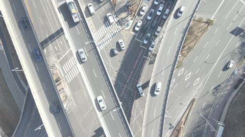 Cars on modern road junction with bridges aerial view.
