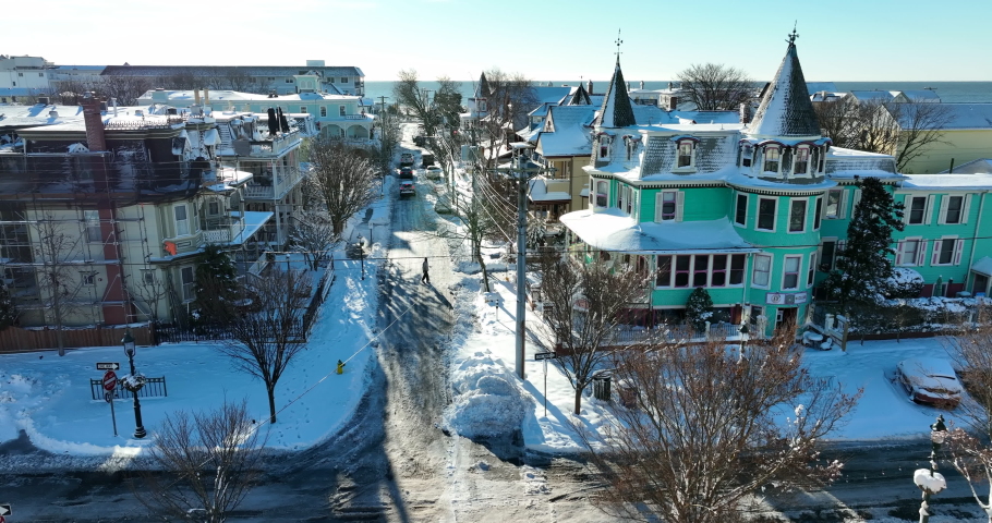 Victorian homes in seaside community, Cape May New Jersey in winter snow. Travel tourism destination. Winter scene.
