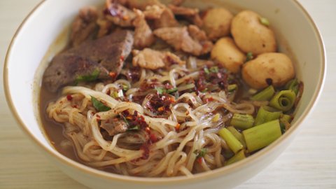 Thai noodle with pork, stewed pork, meatball and pork liver in blood soup - Thai noodles style