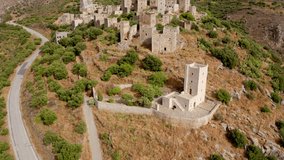 4K aerial - a bird's eye view video (Ultra High Definition) of ancient village fortress of the Mani Peninsula - Vathia. Summer scene of Peloponnese peninsula, Greece. Traveling concept background.