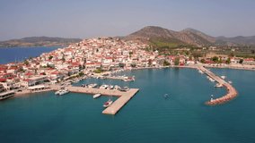 4k drone forward video (Ultra High Definition) of Ermioni port. Sunny morning seascape of Ionian sea. Amazing outdoor scene of Peloponnese peninsula, Greece, Europe. Active tourism concept background.