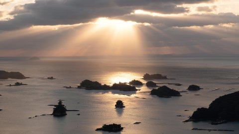 Scenic View of the Sunset over a Sea with Many Small Islands (Timelapse | Zoom Out): Kujukushima Islands in Nagasaki Pref., Japan