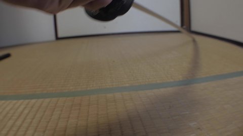 Samurai swords being drawn on tatami