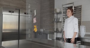 Beautiful female chef using digital augmented reality 3D interface in the kitchen. The buyer chooses cakes in the online store. Futuristic VFX interface concept. - Powered by Shutterstock - Get 15% off with code: PIKWIZARD15