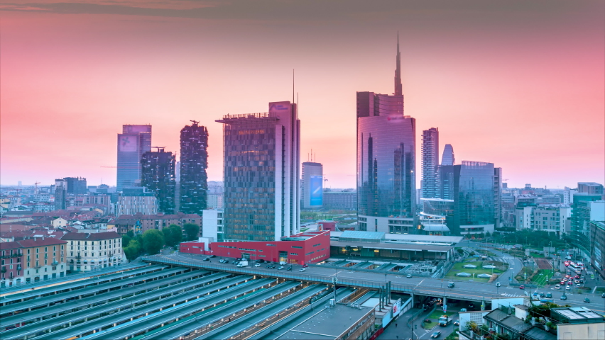 Milan skyline aerial view at sunset, timelapse fromd ay to night milan italy skyscrapers top view, milano skyline in 4k. Royalty-Free Stock Footage #1087021181
