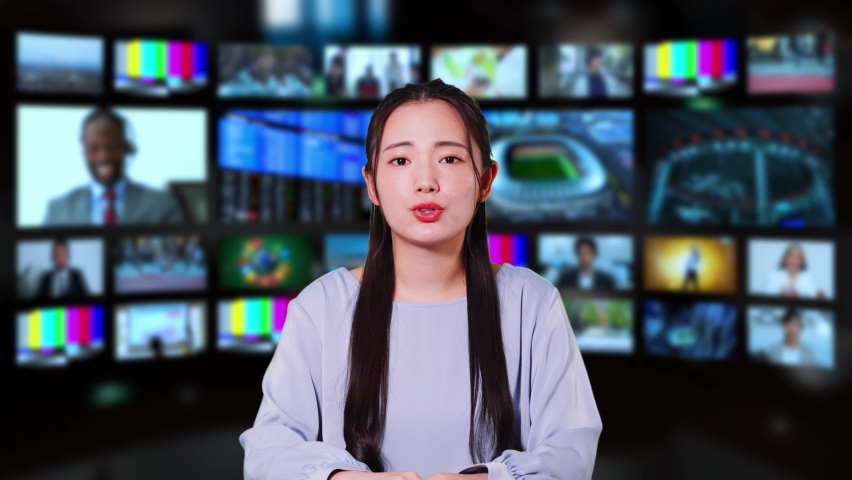 Asian announcer appearing on news program. Royalty-Free Stock Footage #1087023386