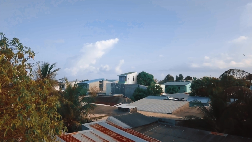 Aerial vertical lift up over the Maldives village