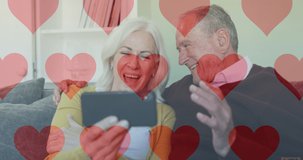 Animation of social media heart icons over senior couple using smartphone. global online social media, connection and communication concept digitally generated video.