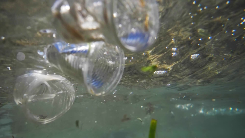 Plastic pollution in oceans, underwater video. plastic pollution crisis, disposable plastics, single-use cups and bottles in the Red Sea | Shutterstock HD Video #1087045985