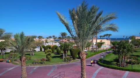 Cleopatra Luxury Resort Makadi hotel in Hurghada resort. View of the grounds and palms tree: Egypt, Hurghada - 3 December, 2021