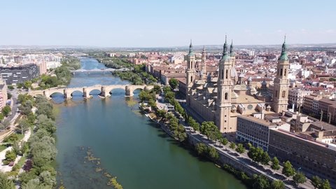 Zaragoza , Spain - 07 26 2021: City Skyline of Zaragoza, Spain - Aerial Drone View of Basilica El Pilar and Ebro River