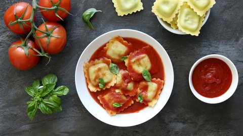 Serving Ravioli in Tomato Sauce