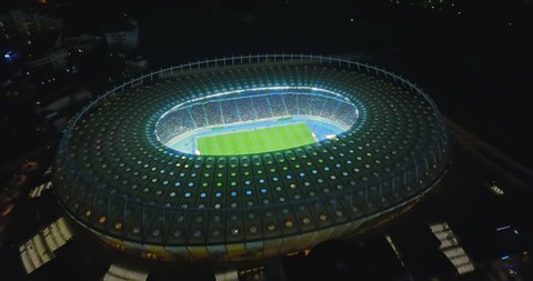 Kiev. Ukraine. National Sports Complex "Olimpiyskiy" October 9, 2017. Drone shot at a sports stadium on the day of a football match at night.Camera looks down on a football field with football players