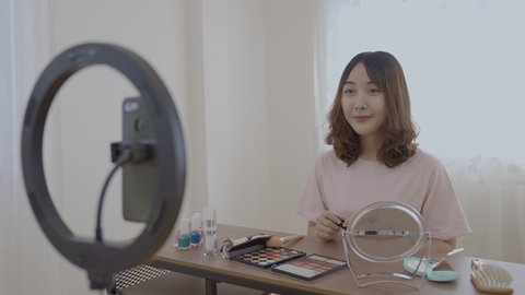 Holiday concept of 4k Resolution. Asian girls are teaching makeup on the internet at home.