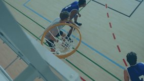 Animation of fight texts over diverse group of male basketball players at gym. global sports and healthy lifestyle concept digitally generated video.