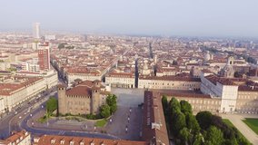 Inscription on video. Turin, Italy. Flight over the city. Historical center, top view. Castle Square. Flames with dark fire, Aerial View