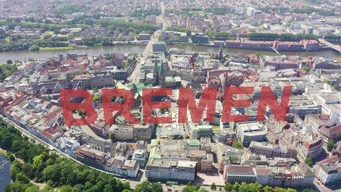 Inscription on video. Bremen, Germany. The historic part of Bremen, the old town. Bremen Cathedral ( St. Petri Dom Bremen ). View in flight. On the mechanical display, Aerial View, Departure of the c