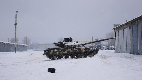 Kharkiv, Ukraine - January, 31, 2022: The tank in the military unit turns around and leaves. The Ukrainian army is preparing to defend against the Russian invasion