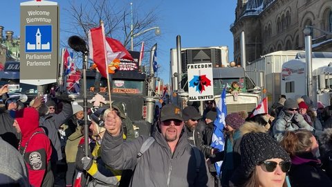 Ottawa Ontario Canada February 5 2022. Freedom Convoy 2022 Canadian Parliament Hill crowd protesting against government's COVID-19 vaccine mandate and other restrictions.