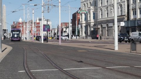 Blackpool, Great Britain - September 26, 2021: Famous Blackpool Tram on seafront promenade. Holiday vacation seaside resort in Lancashire.