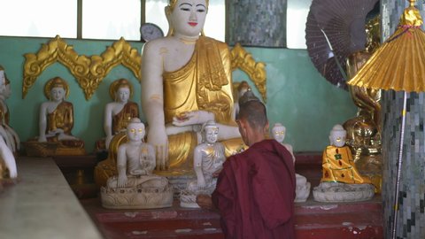YANGON, MYANMAR - 2TH FEBRUARY, 2019: Monk in the Shwedagon Pagoda, Yangon, Myanmar, Asia